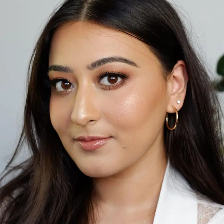 Soft bronze glam, a nude lip and long dark hair